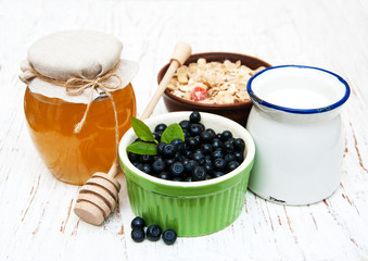 Muesli with berries, honey and milk