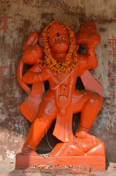 Orange Statue of Lord Hanuman, the Hindu Monkey Deity in Varanasi, India