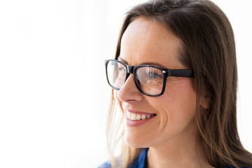 close up of smiling middle aged woman in glasses