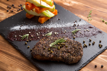 fried piece of meat with grilled vegetables