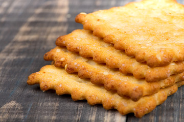 Macro shot of crackers with salt lying in a stack one on one