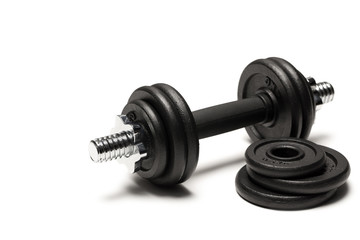 Obraz na płótnie Canvas close up of iron dumbbell with weight plates isolated on white