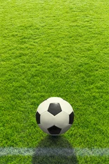 Papier Peint photo Foot Contexte un ballon de football se trouve devant une ligne sur l& 39 herbe