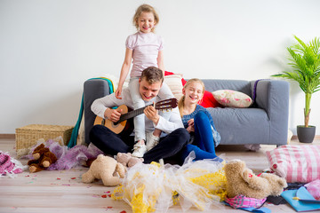 Girls playing with father