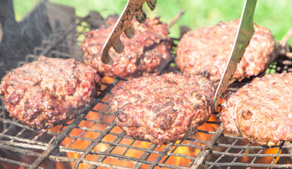 Top view of burger chops preparing on grill