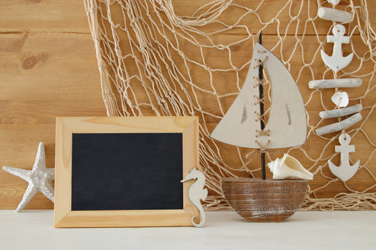 Nautical concept with sea life style objects on wooden table.