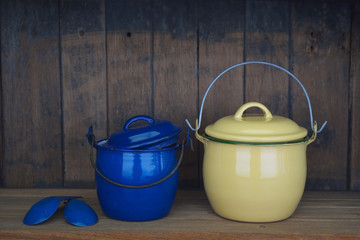 Vintage metal pot on wooden background