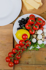 Vegetable salad with cheese and quail eggs, cherry tomatoes.