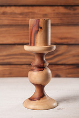 wooden candle holder on wooden background rural style