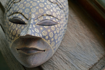 Handmade wood mask on wood background