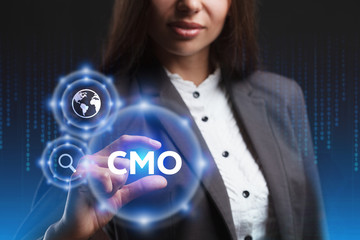 The concept of business, technology, the Internet and the network. A young entrepreneur working on a virtual screen of the future and sees the inscription: CMO