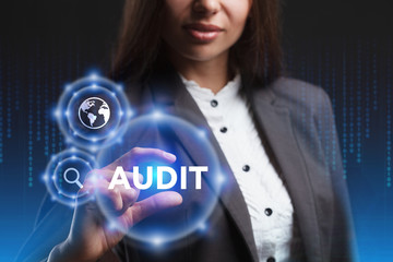 The concept of business, technology, the Internet and the network. A young entrepreneur working on a virtual screen of the future and sees the inscription: Audit