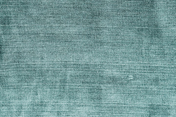 Cyan color weathered denim texture.