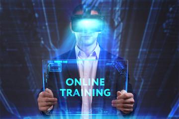 Business, Technology, Internet and network concept. Young businessman working in virtual reality glasses sees the inscription: Online training