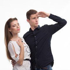 Young pensive couple portrait of a confident businessman showing presentation, gray background. Ideal for banners, registration forms, presentation, landings, presenting concept.