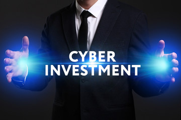 Business, Technology, Internet and network concept. Young businessman working on a virtual screen of the future and sees the inscription: Cyber investment