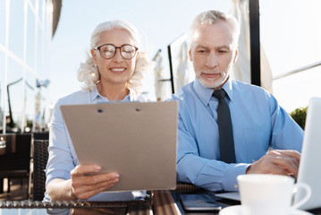 Fototapeta premium Serious bearded man looking at folder
