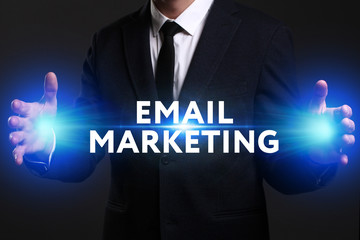 Business, Technology, Internet and network concept. Young businessman working on a virtual screen of the future and sees the inscription: Email marketing