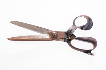 Open old tailor shears isolated on white