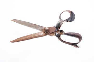 Open old tailor shears isolated on white