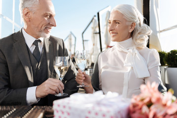 Attractive female holding glass with champagne
