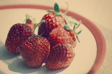 Strawberry on white plate