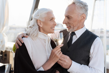 Delighted blonde woman celebrating anniversary