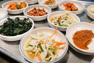 Korean meal side dishes vegetable, kinchi, groundnuts, garlic, bean sprout