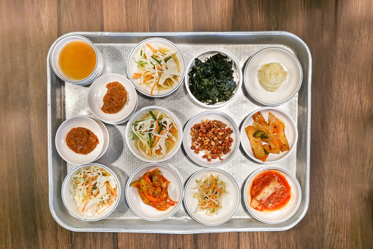 Korean meal side dishes vegetable, kinchi, groundnuts, garlic, bean sprout