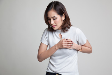 Young Asian woman got chest pain.