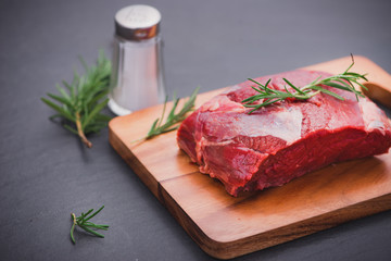 Raw beef meat on a cutting board