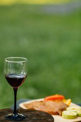  grilled meat with vegetables and wine