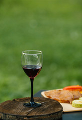 grilled meat with vegetables and wine
