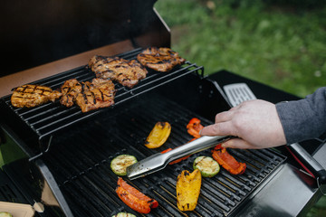 male  hand cooking barbecue