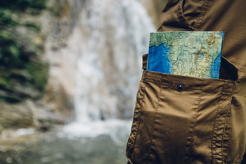 Unrecognizable Man Standing With Travel Map In Pocket Closeup Hiking Travel Tourism Concept