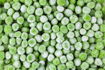 Frozen fresh vegetables, green food background, close-up, beans, peas. A healthy diet.