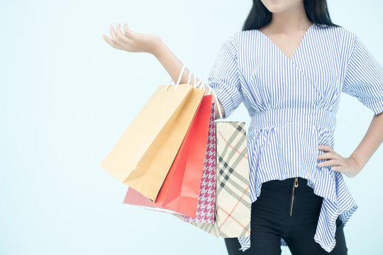 Hand of woman resting for shopping with colorful bag, isolated on white background with parth.