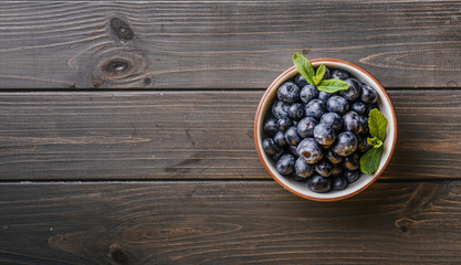 Blueberry. Freshly picked blueberries over wooden table. J