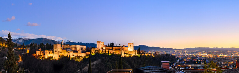 Fototapeta na wymiar Alhambra fortress night view against Sierra Nevada mountains, Granada, Spain