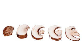 Cep mushrooms champignons cut into thin slices, isolated on white background
