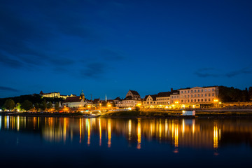 Fototapeta na wymiar Night view of the Pirna city over the Elbe river in Saxon Switzerland, Germany