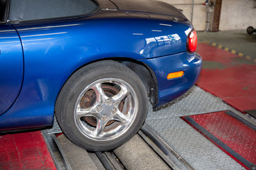 machine in the garage to control the condition of the suspensions and the braking of the wheels