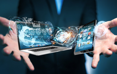 Businessman connecting tech devices to each other 3D rendering