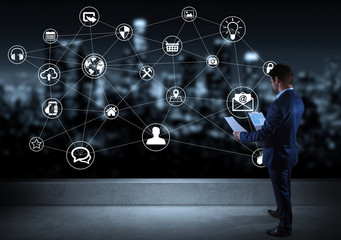 Businessman watching social network interface on a rooftop 3D rendering