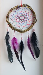 Foto of handmade dreamcatcher with feathers and beads