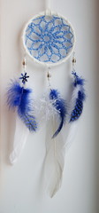 Foto of handmade dreamcatcher with feathers and beads