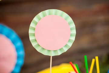 Paper fan on stick. Decoration Candy Bar.