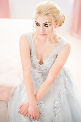 Fashion bride in gray dress with make-up smoky eyes