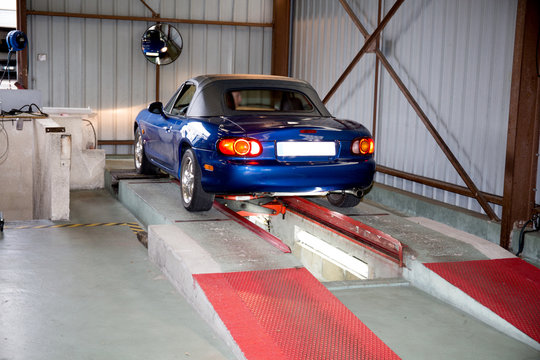 Car In The Garage On A Ramp To Control The Under And Braking