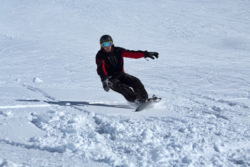 Fototapeta na wymiar snowboarder is riding